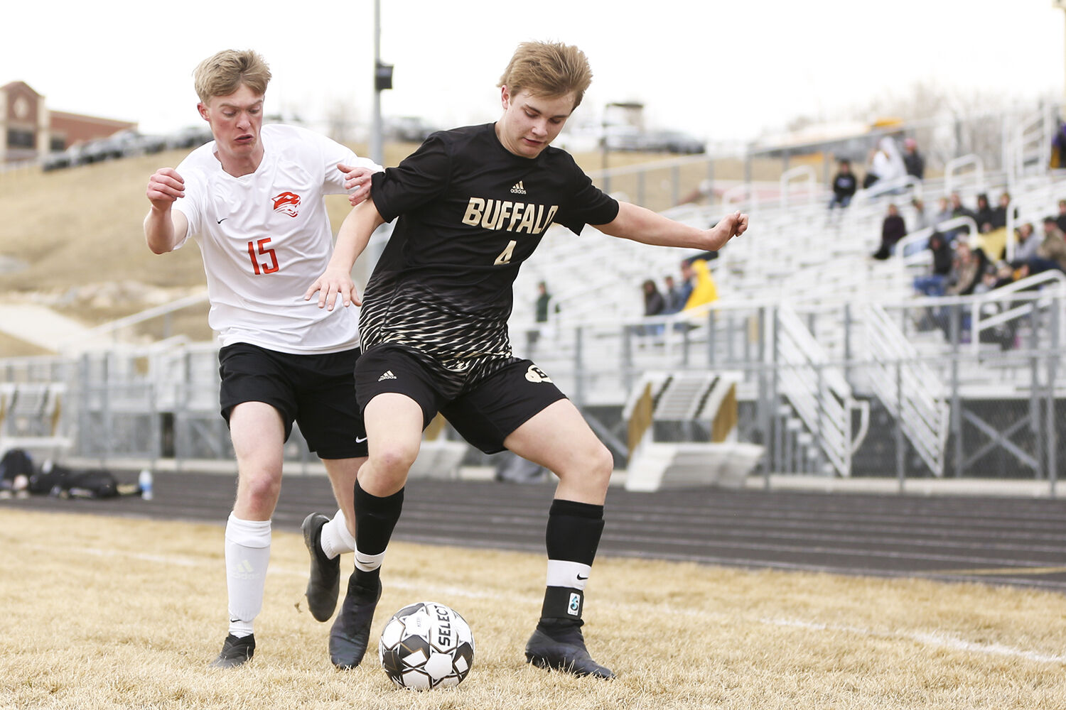 Zander Hulet blocks out Powell sophomore Daniel Brown